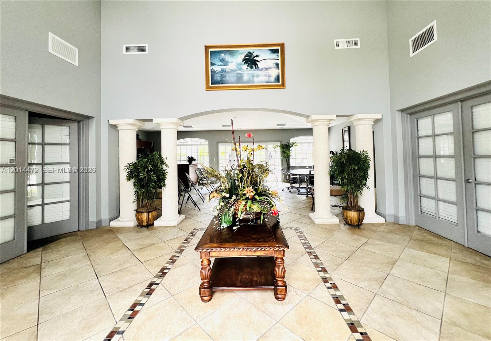 15410 Southwest 284th Street, Unit 8102 Homestead, FL 33033 - Photo 17 of 18 a room with patio furniture and a large window