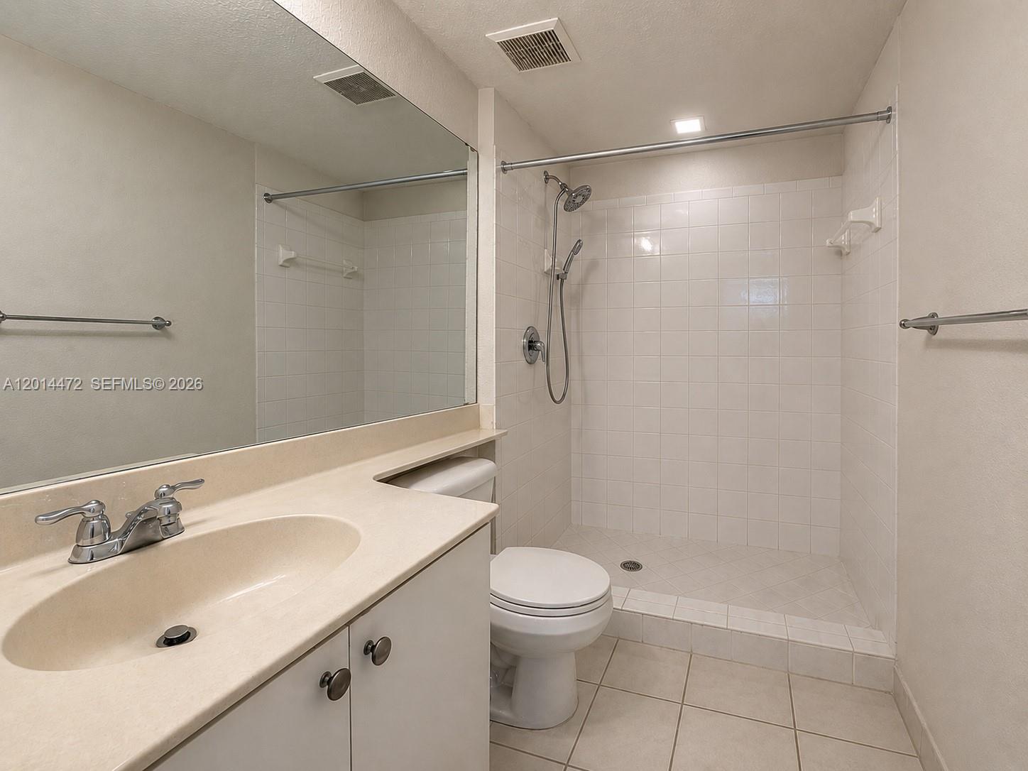 15410 Southwest 284th Street, Unit 8102 Homestead, FL 33033 - Photo 8 of 18 a bathroom with a sink toilet and shower