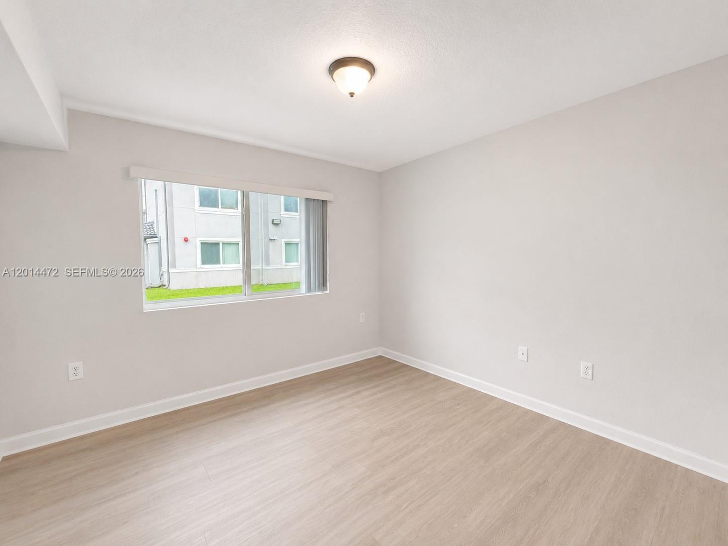 15410 Southwest 284th Street, Unit 8102 Homestead, FL 33033 - Photo 9 of 18 an empty room with window