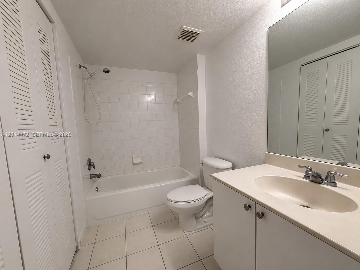15410 Southwest 284th Street, Unit 8102 Homestead, FL 33033 - Photo 10 of 18 a bathroom with a sink a toilet and shower