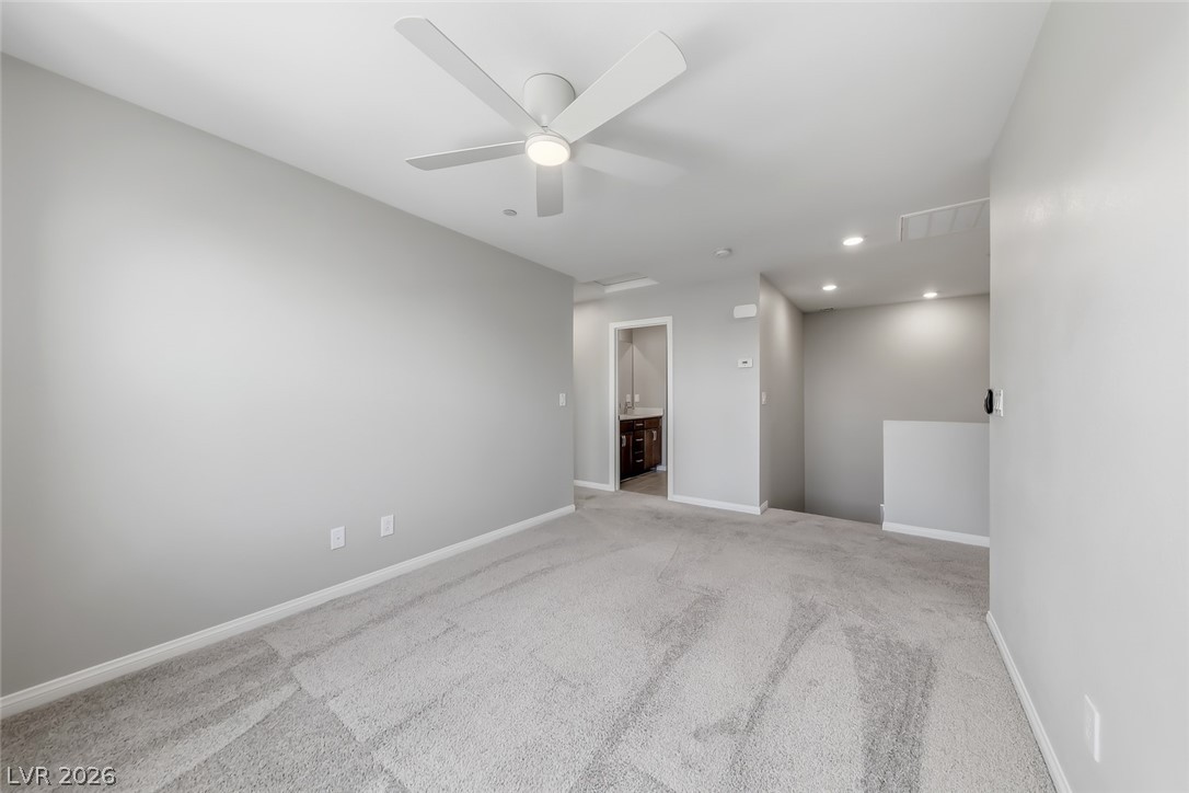 3564 Credere Lane Henderson, NV 89074 - Photo 15 of 40 Unfurnished room with light colored carpet and ceiling fan