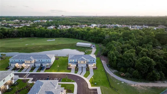 an aerial view of a house with a garden