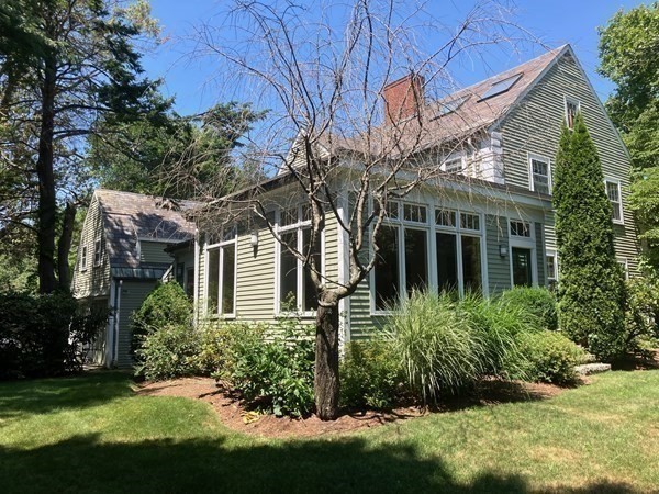 3 Glenoe Road Brookline, MA 02467 - Photo 3 of 7 a front view of a house with a yard and potted plants