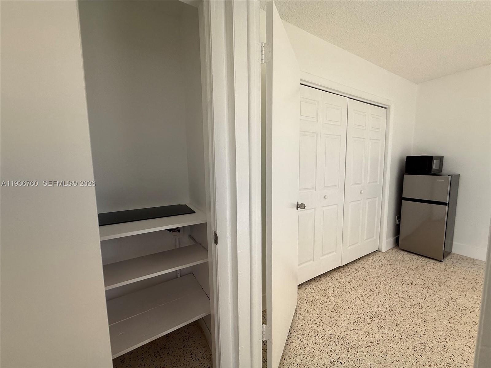 3144 Northwest 29th Street, Unit 1 Miami, FL 33142 - Photo 3 of 6 a view of an empty room