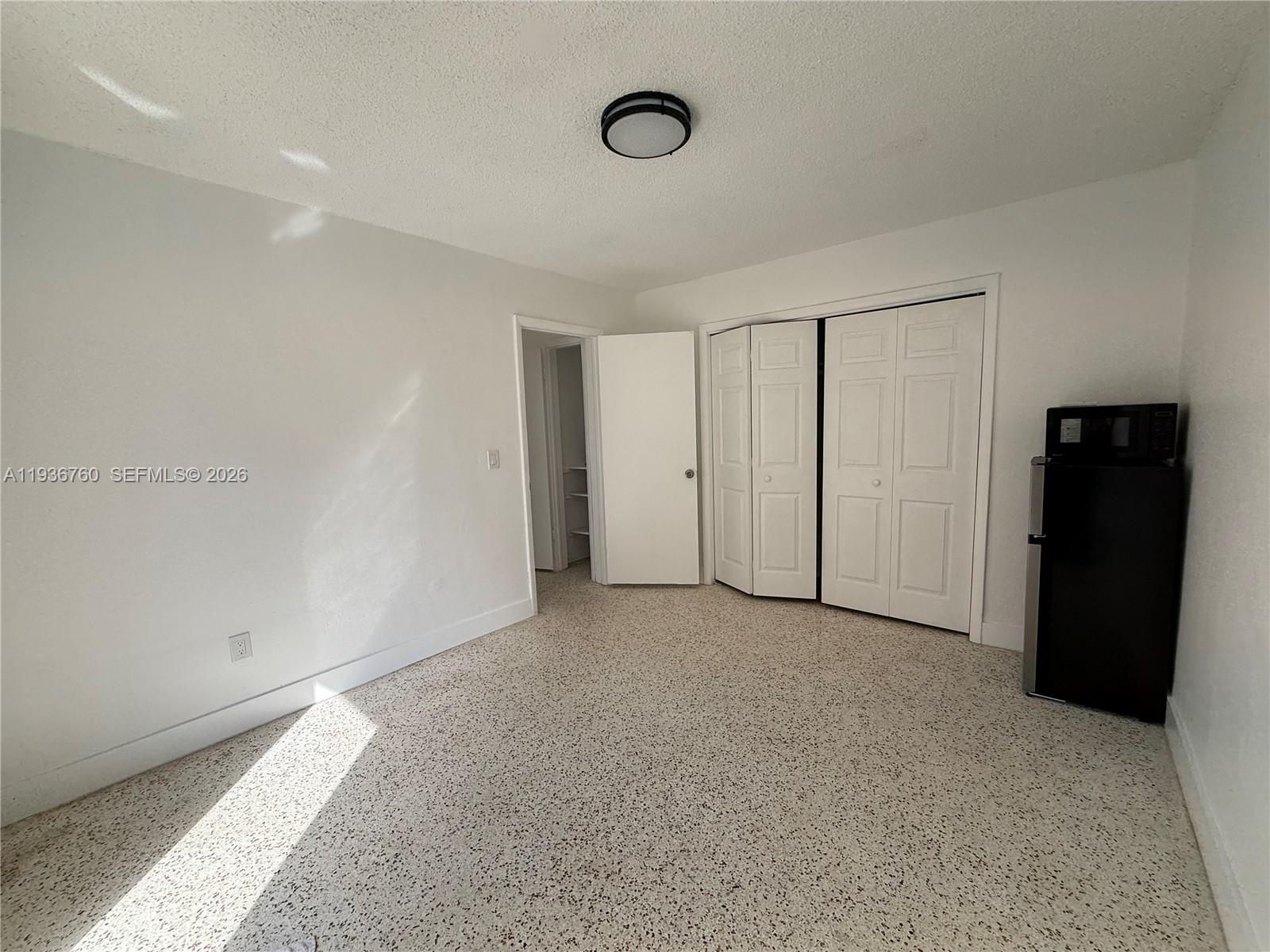 3144 Northwest 29th Street, Unit 1 Miami, FL 33142 - Photo 6 of 6 a view of an empty room