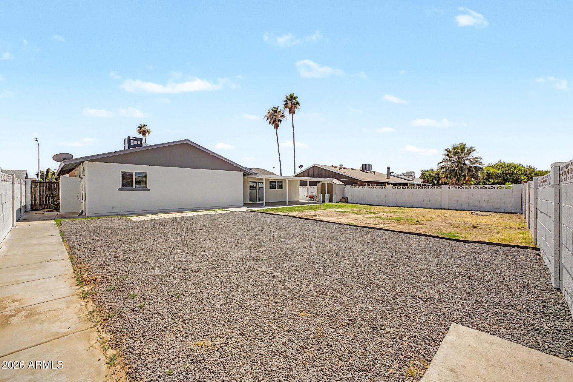 5232 West Hearn Road Glendale, AZ 85306 - Photo 26 of 32 a front view of a house with a yard