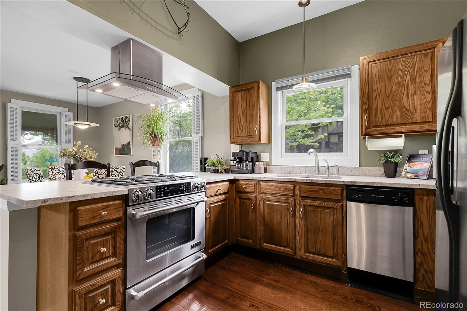 503 15th Street Golden, CO 80401 - Photo 11 of 30 a kitchen with a stove a sink and a window