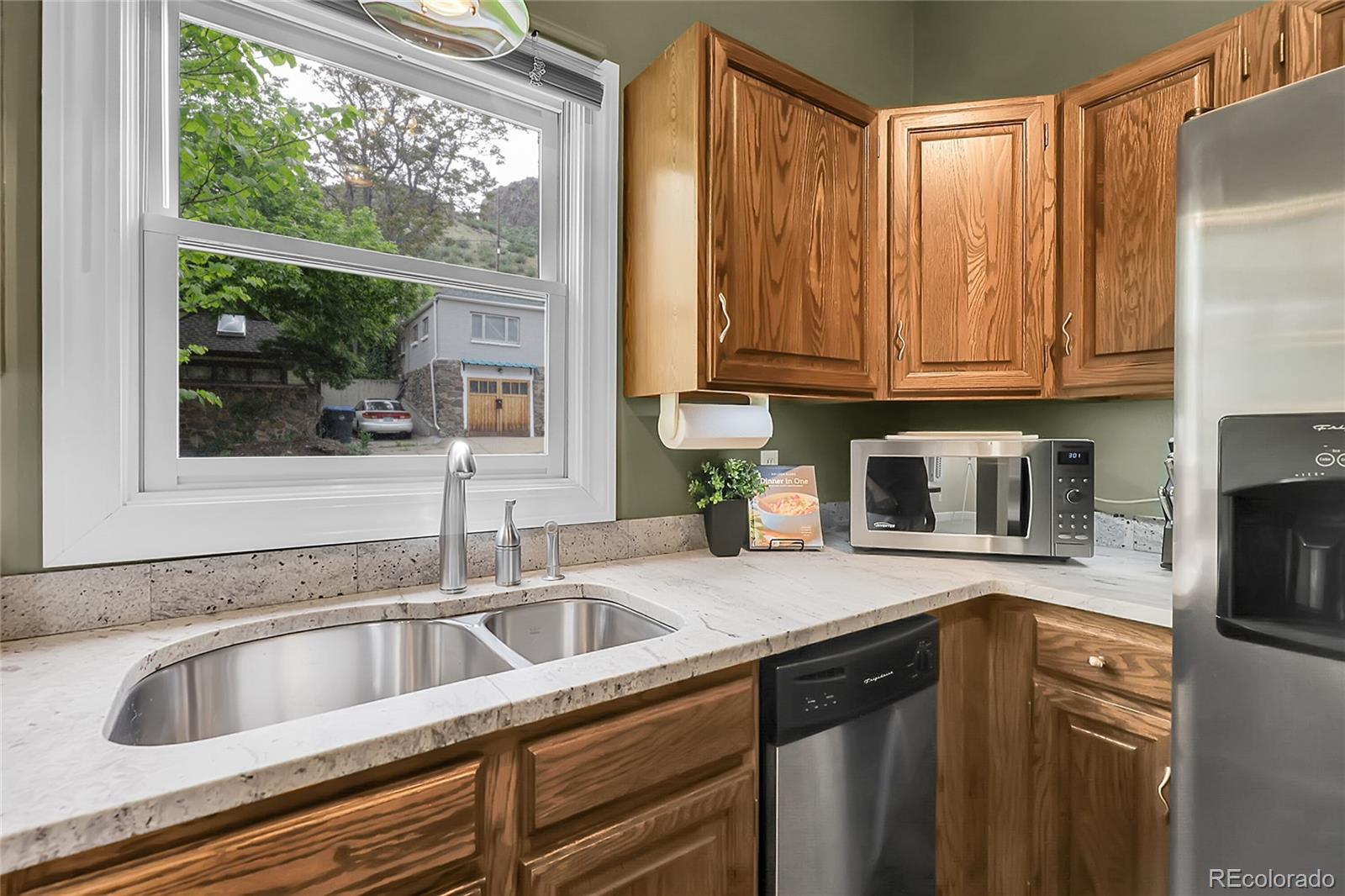 503 15th Street Golden, CO 80401 - Photo 12 of 30 a kitchen with granite countertop a sink and a window