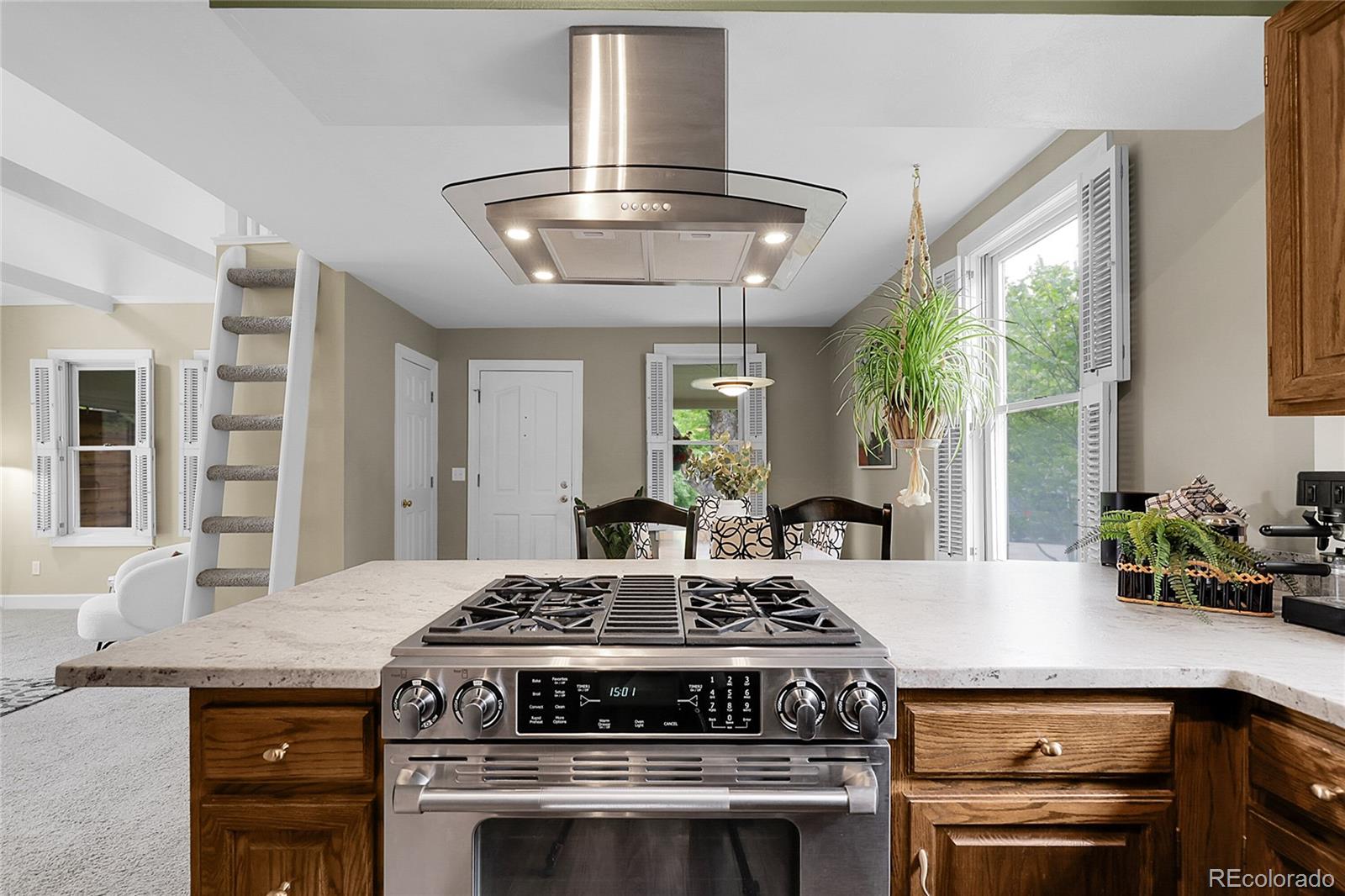 503 15th Street Golden, CO 80401 - Photo 13 of 30 a kitchen with a stove and a white cabinets