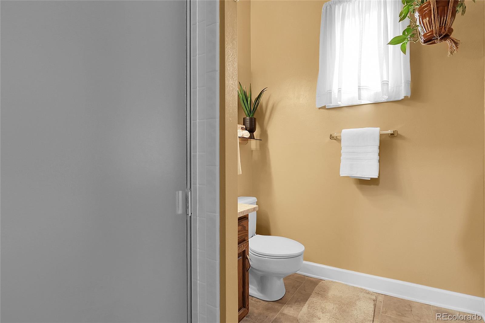 503 15th Street Golden, CO 80401 - Photo 15 of 30 a white toilet sitting next to a bathroom sink