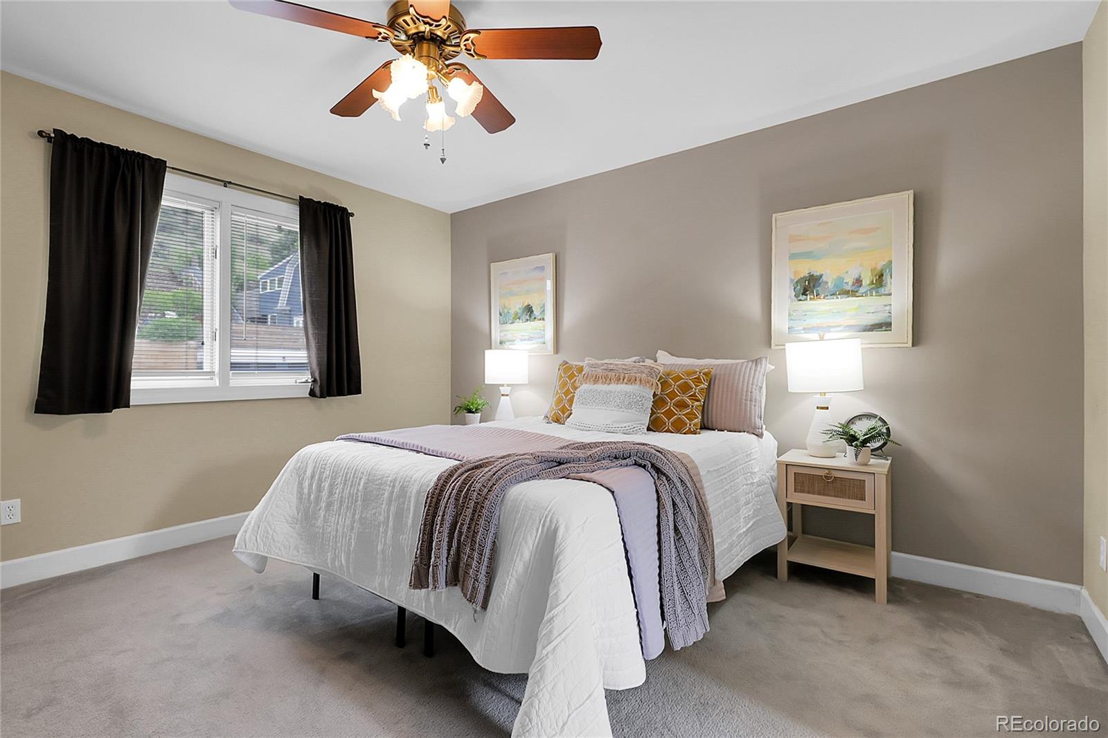 503 15th Street Golden, CO 80401 - Photo 18 of 30 a bedroom with a bed and a chandelier