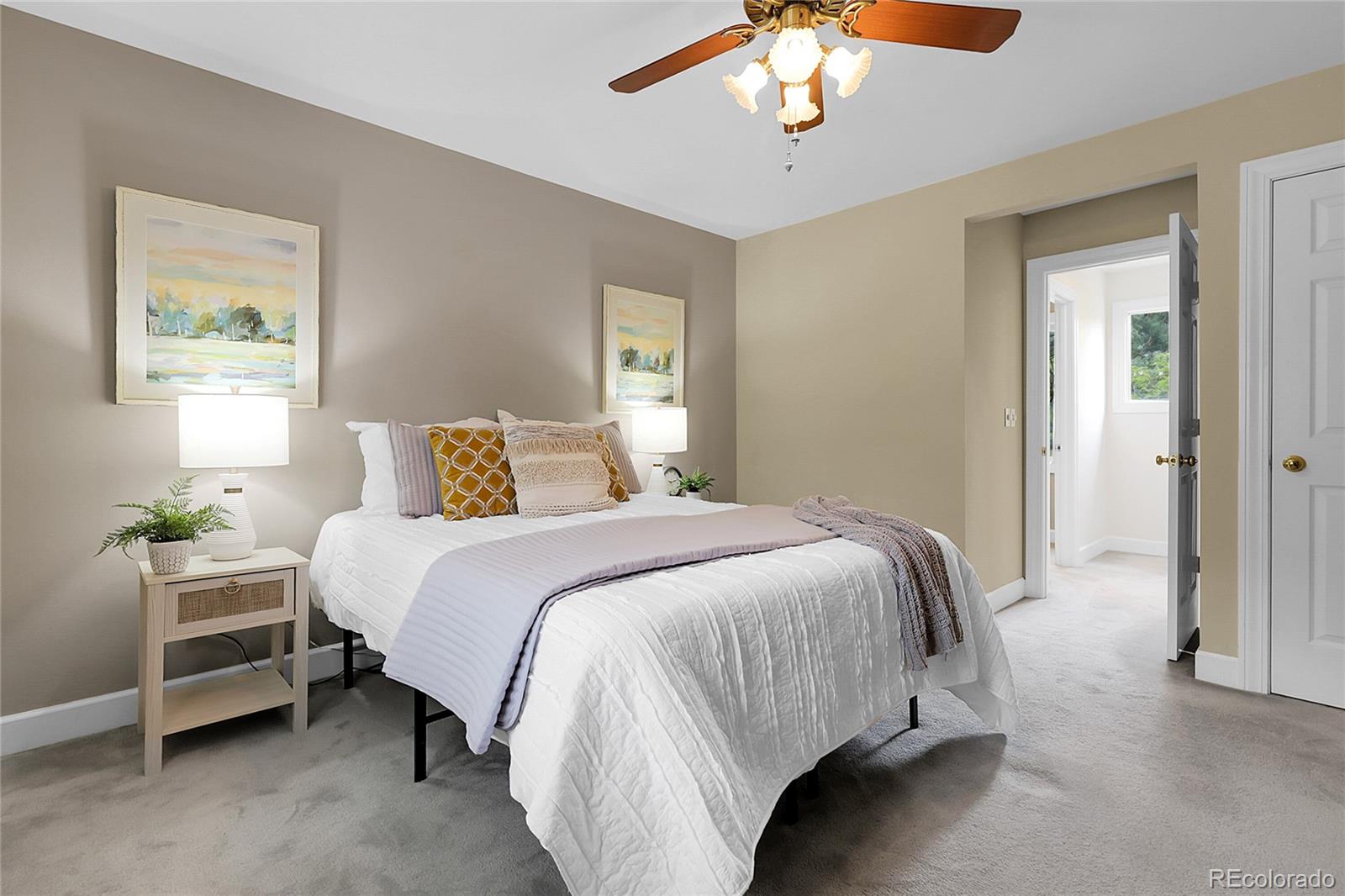 503 15th Street Golden, CO 80401 - Photo 19 of 30 a bedroom with a bed and a chandelier