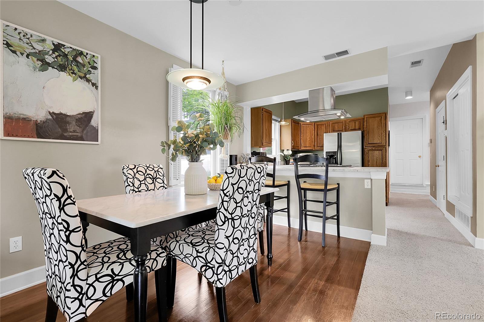 503 15th Street Golden, CO 80401 - Photo 4 of 30 a view of a dining room with furniture and wooden floor