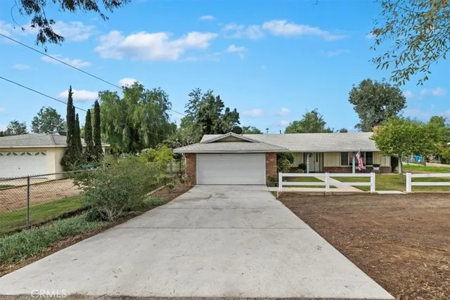 a house view with a garden space