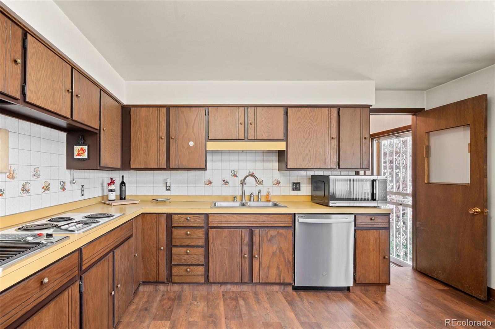 5410 Indiana Street Golden, CO 80403 - Photo 15 of 50 a kitchen with a sink stove and cabinets
