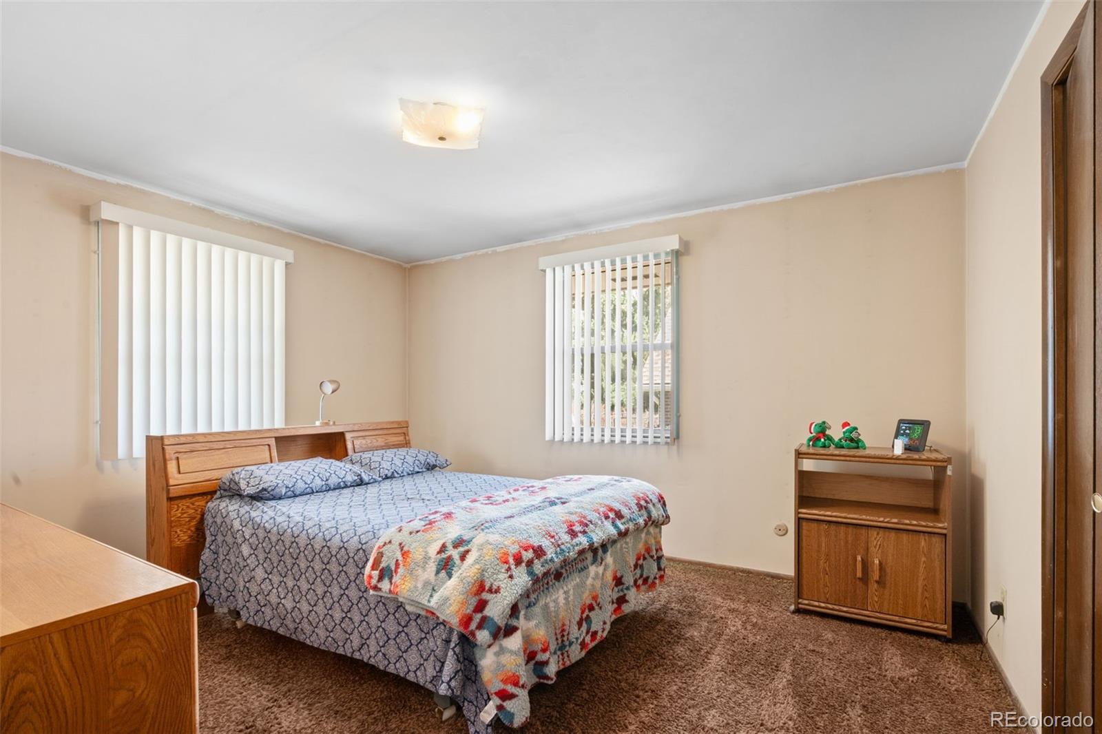 5410 Indiana Street Golden, CO 80403 - Photo 20 of 50 a bedroom with a bed and a window
