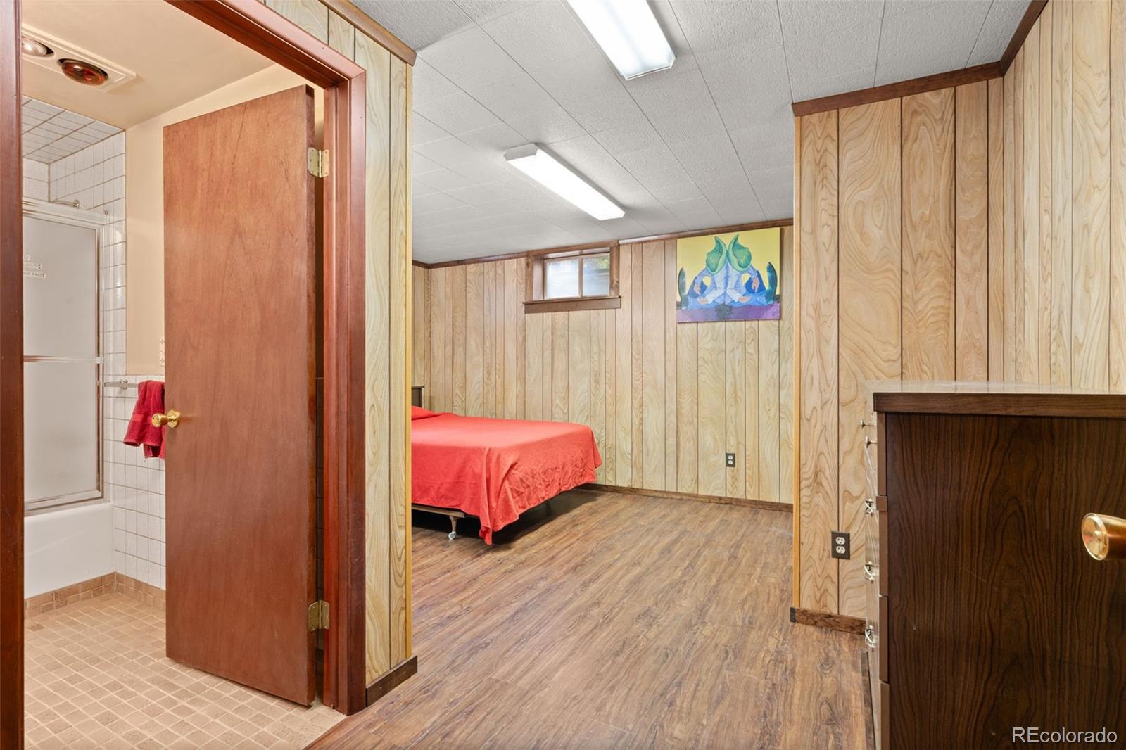 5410 Indiana Street Golden, CO 80403 - Photo 23 of 50 a spacious bedroom with a bed and a window