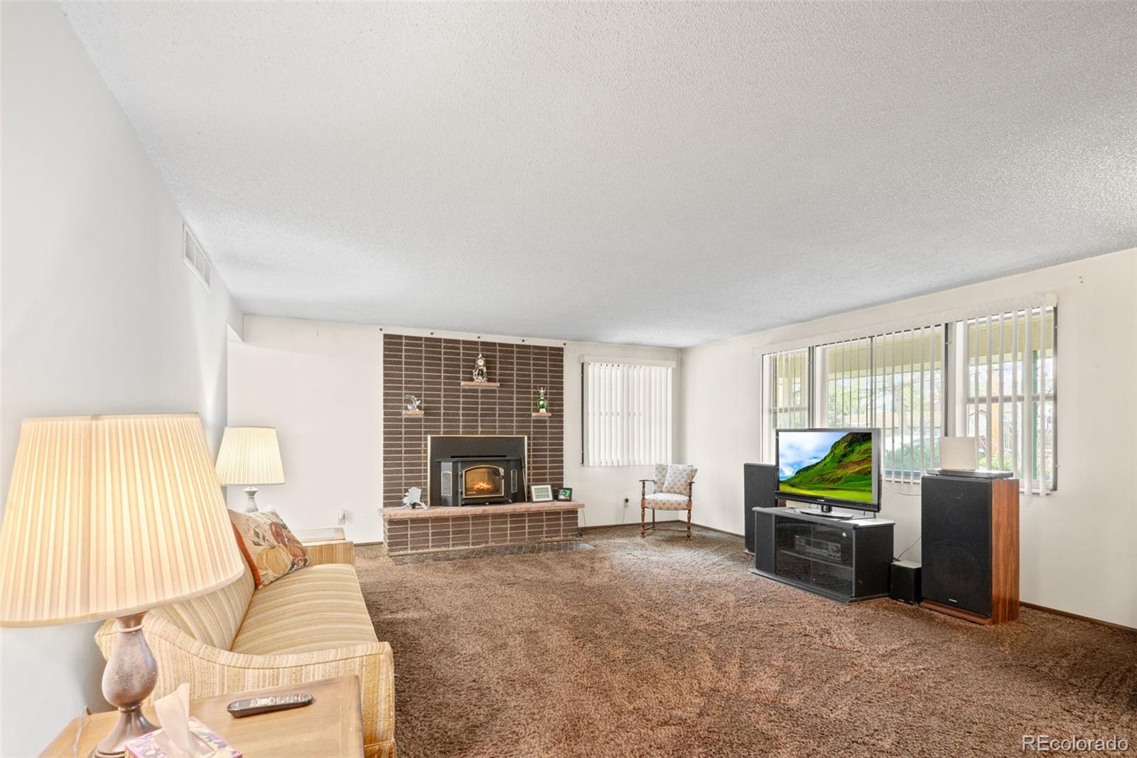 5410 Indiana Street Golden, CO 80403 - Photo 6 of 50 a living room with furniture and large windows