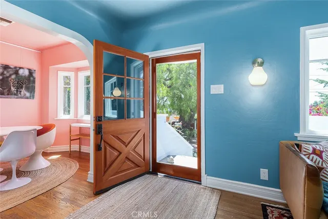 a view of a room with furniture and windows