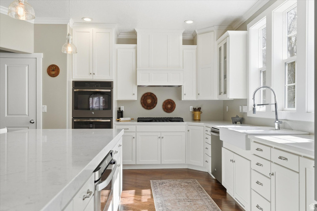 353 Robin Street Smithfield, UT 84335 - Photo 6 of 70 Kitchen with white cabinetry, stainless steel appliances, pendant lighting, and ornamental molding