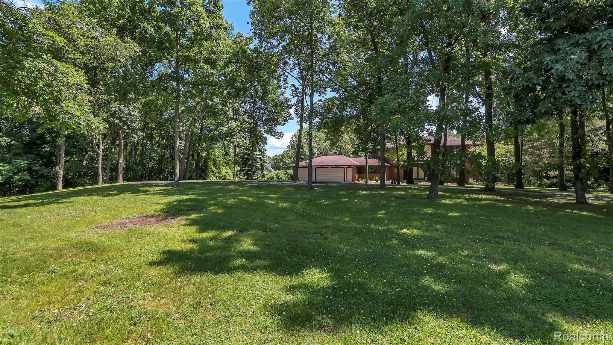 5207 Mountain Road Brighton, MI 48116 - Photo 34 of 42 Wooded front