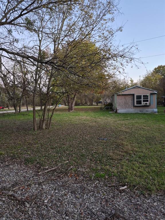 3373 Northeast 0160 Road Powell, TX 75153 - Photo 2 of 6 a view of a house with a yard