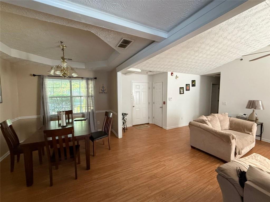 2851 Stanton Road Southeast Conyers, GA 30094 - Photo 11 of 11 a living room with furniture dining table and a large window