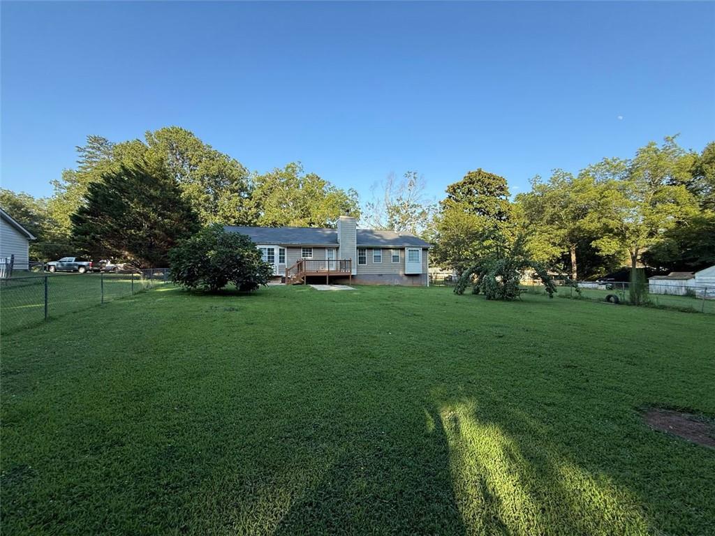 2851 Stanton Road Southeast Conyers, GA 30094 - Photo 3 of 11 a view of a house with a big yard