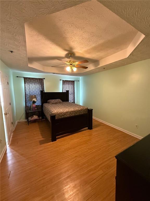 2851 Stanton Road Southeast Conyers, GA 30094 - Photo 7 of 11 a bedroom with a bed and a night stand