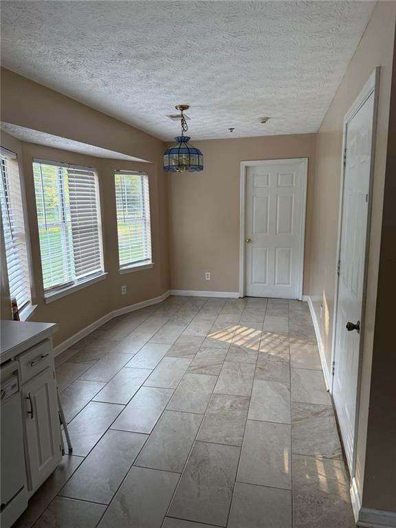 2851 Stanton Road Southeast Conyers, GA 30094 - Photo 10 of 11 a view of an empty room with a window