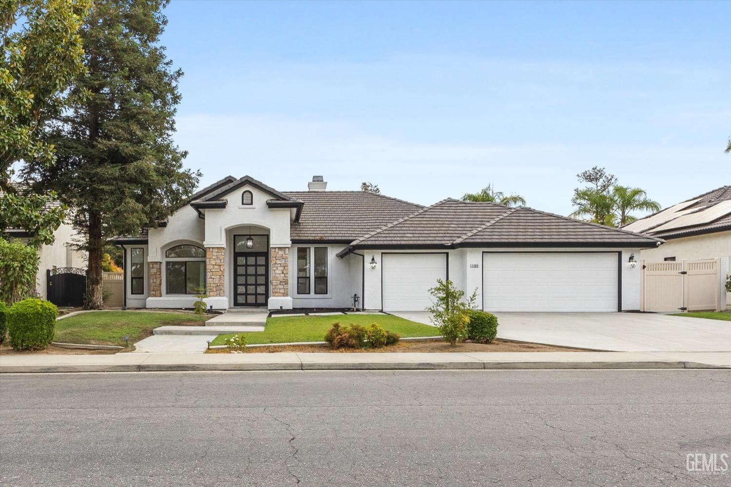 Undisclosed Address Bakersfield, CA 93311 - Photo 11 of 67 front view of a house with a yard