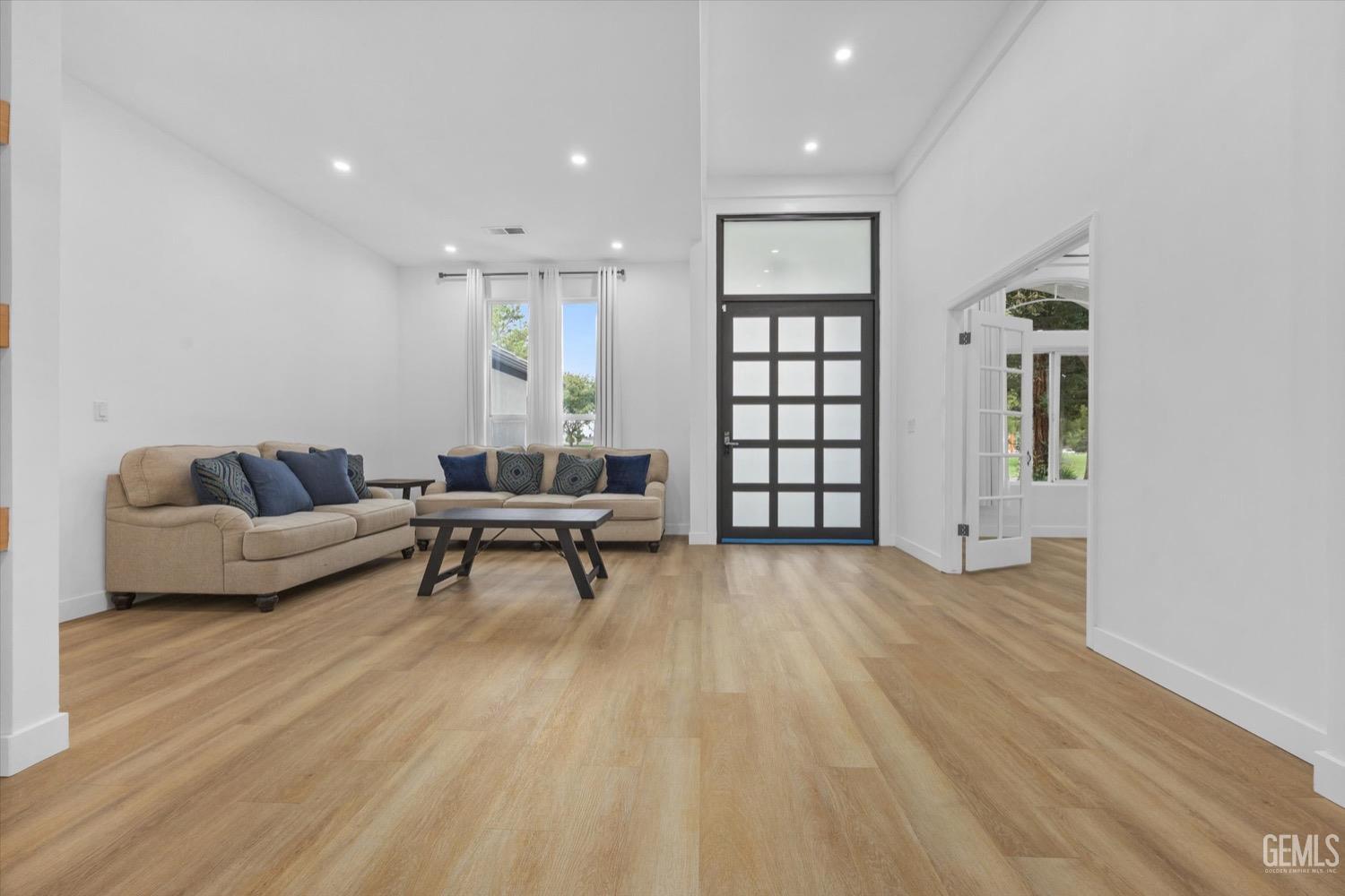Undisclosed Address Bakersfield, CA 93311 - Photo 15 of 67 a living room with furniture and a wooden floor
