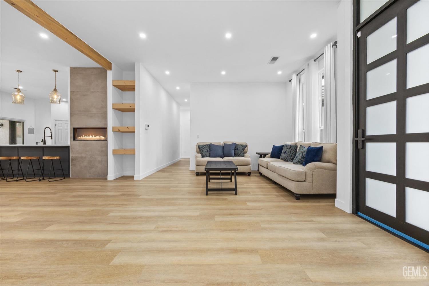 Undisclosed Address Bakersfield, CA 93311 - Photo 16 of 67 a living room with furniture and a large window