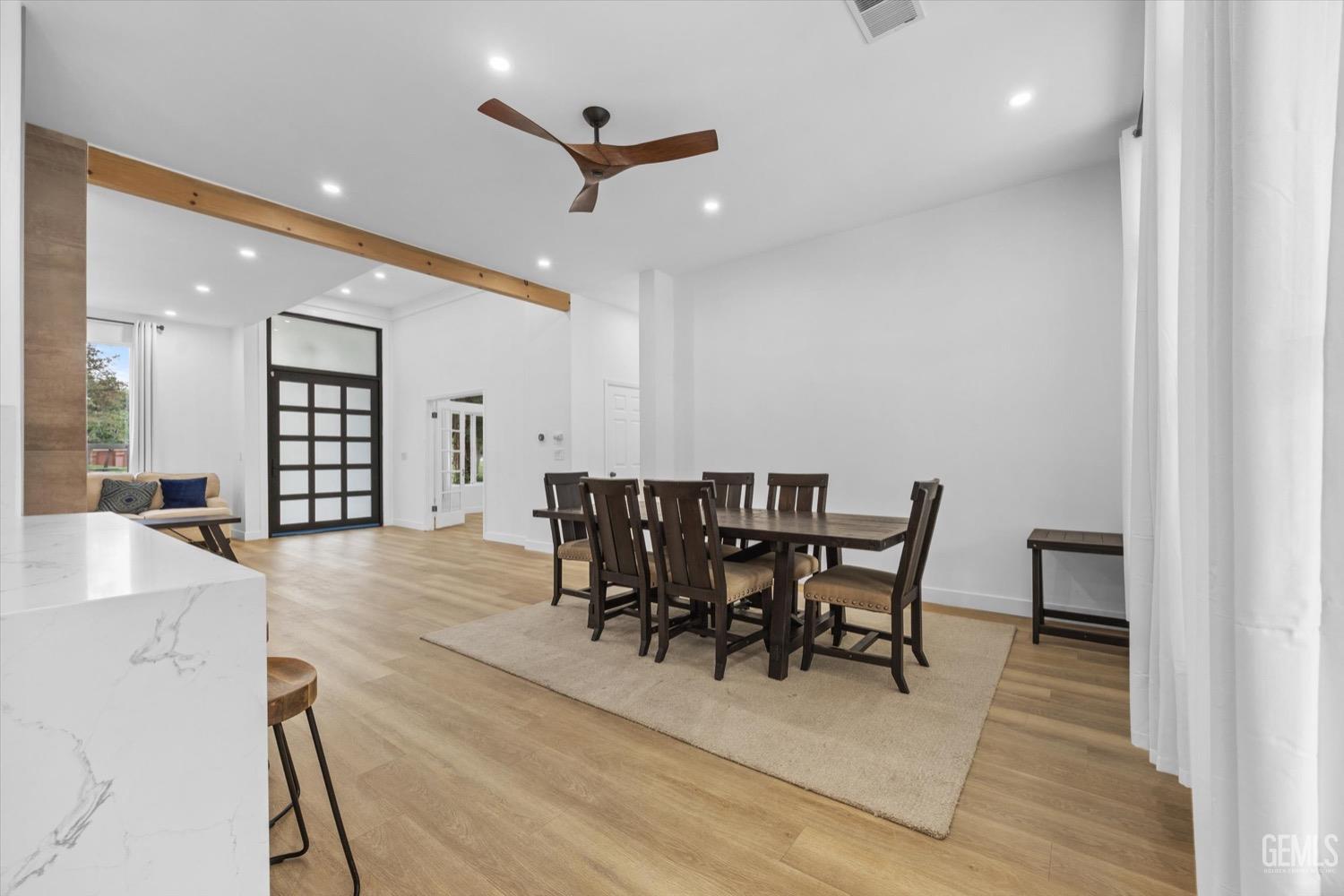 Undisclosed Address Bakersfield, CA 93311 - Photo 21 of 67 a view of a dining room with furniture and wooden floor