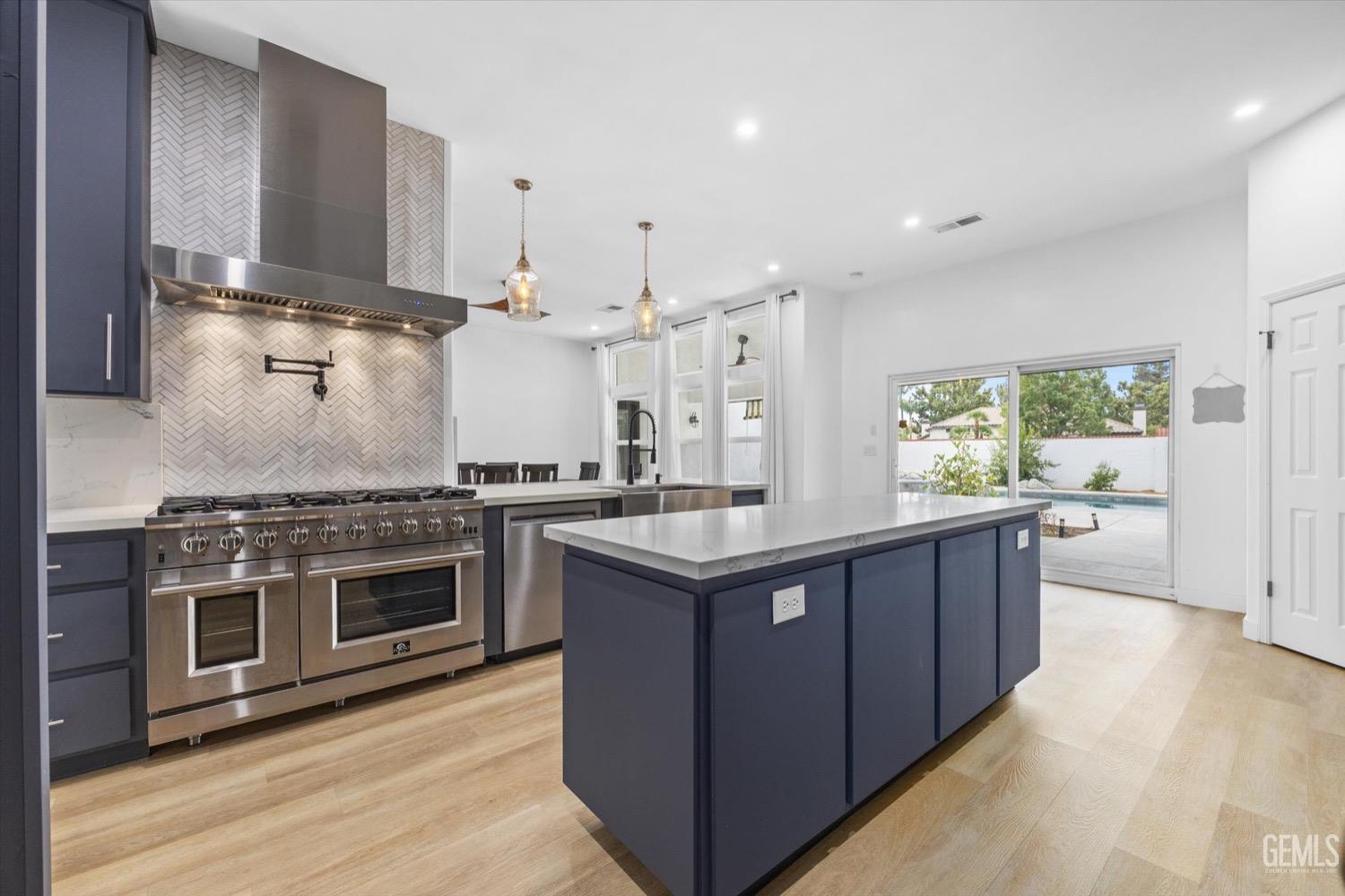 Undisclosed Address Bakersfield, CA 93311 - Photo 31 of 67 a kitchen with stainless steel appliances granite countertop a stove and a sink