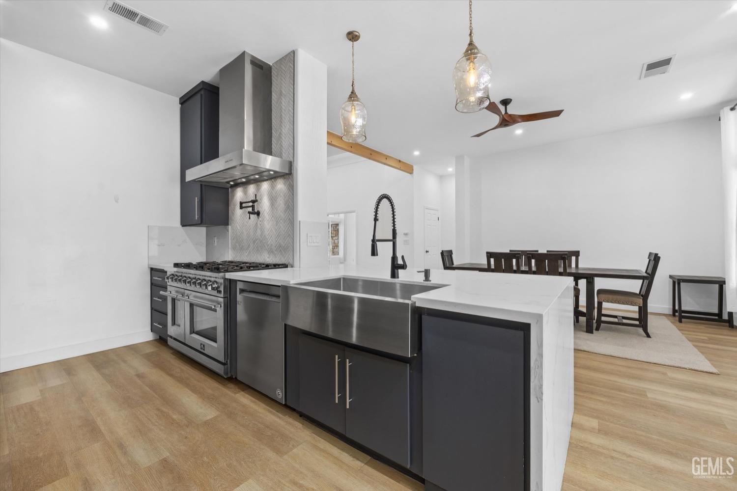 Undisclosed Address Bakersfield, CA 93311 - Photo 32 of 67 a kitchen with stainless steel appliances a sink and stove