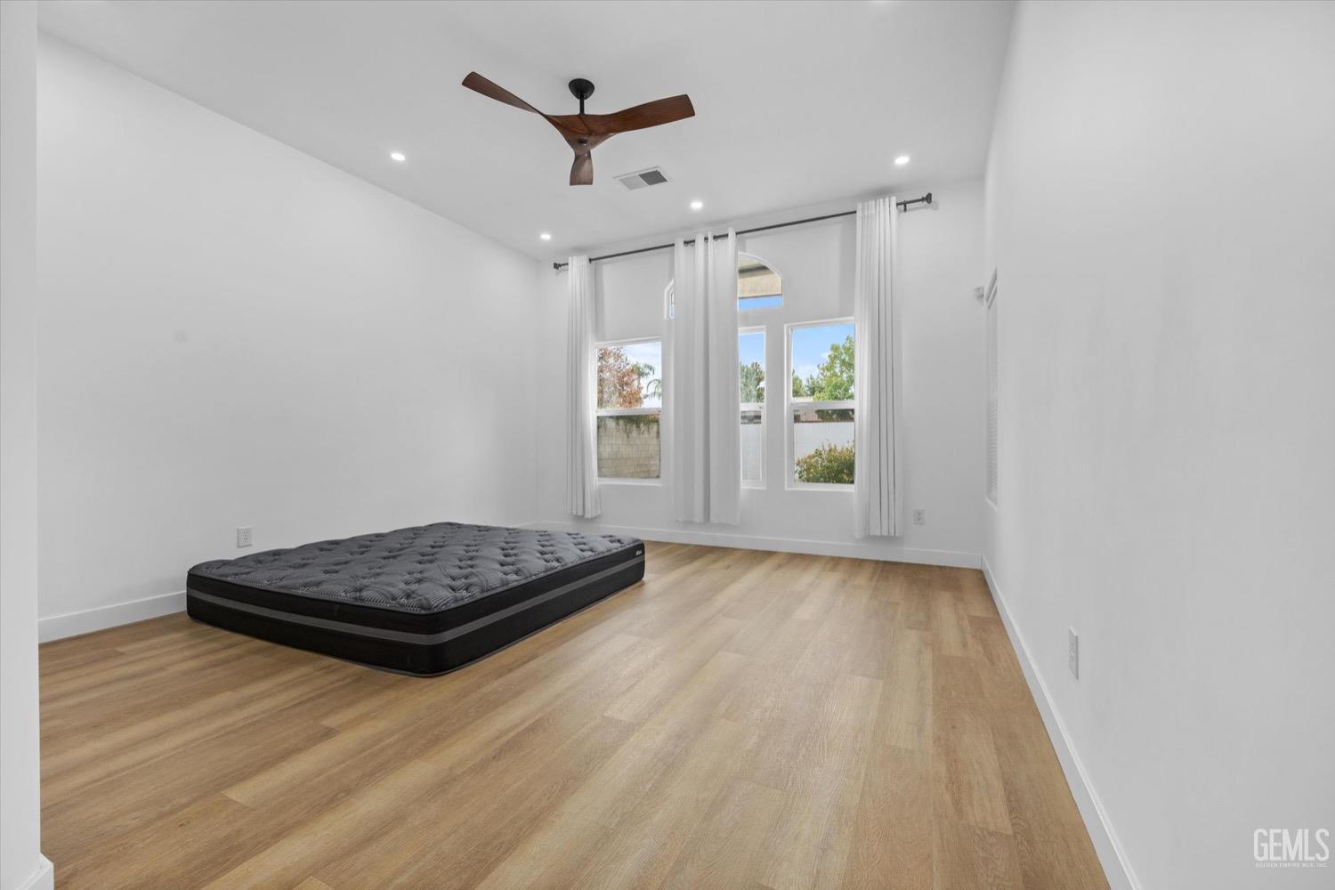 Undisclosed Address Bakersfield, CA 93311 - Photo 36 of 67 a living room with hard wood floors and a window