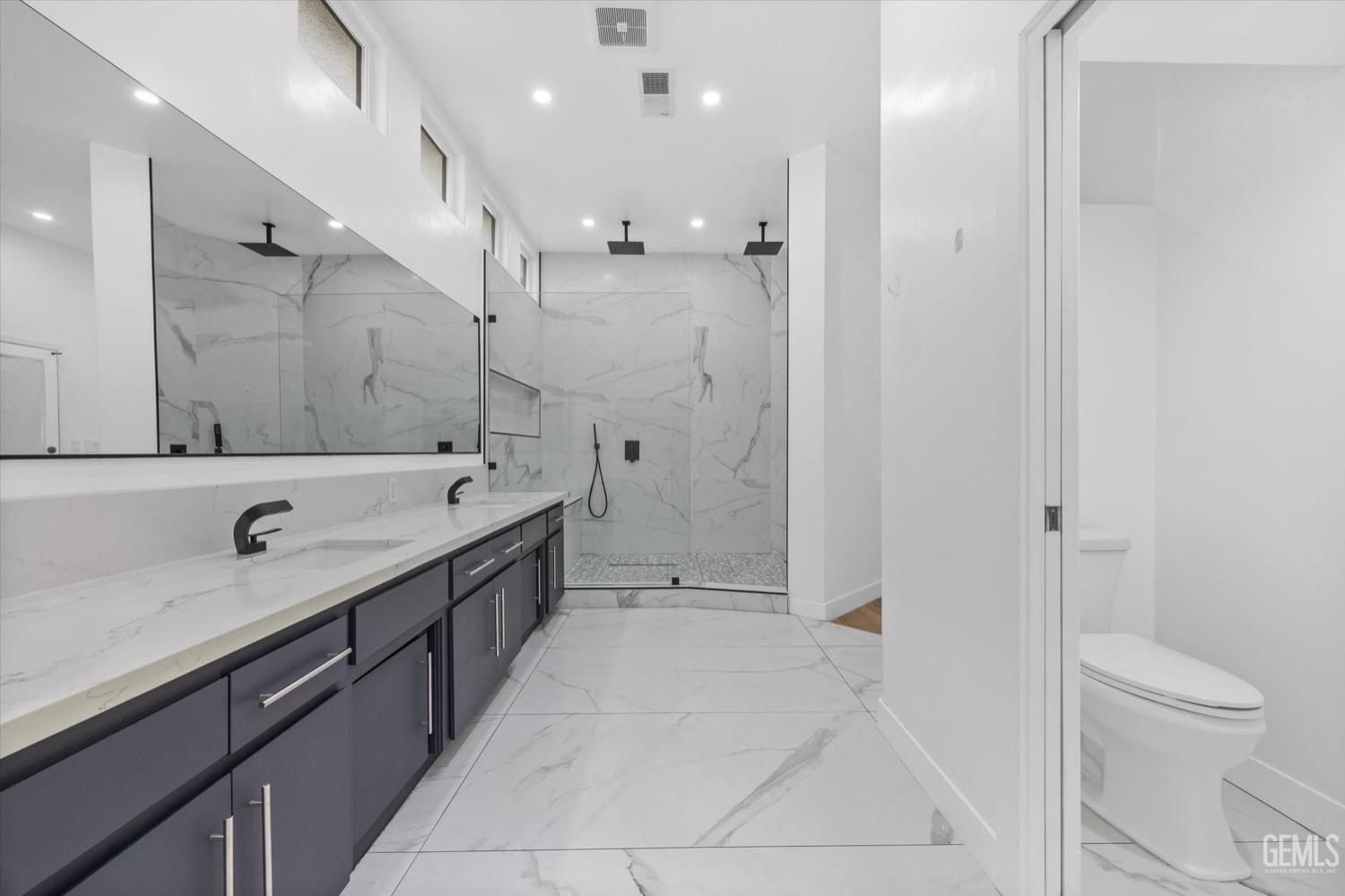 Undisclosed Address Bakersfield, CA 93311 - Photo 38 of 67 a bathroom with a double vanity sink mirror double and shower