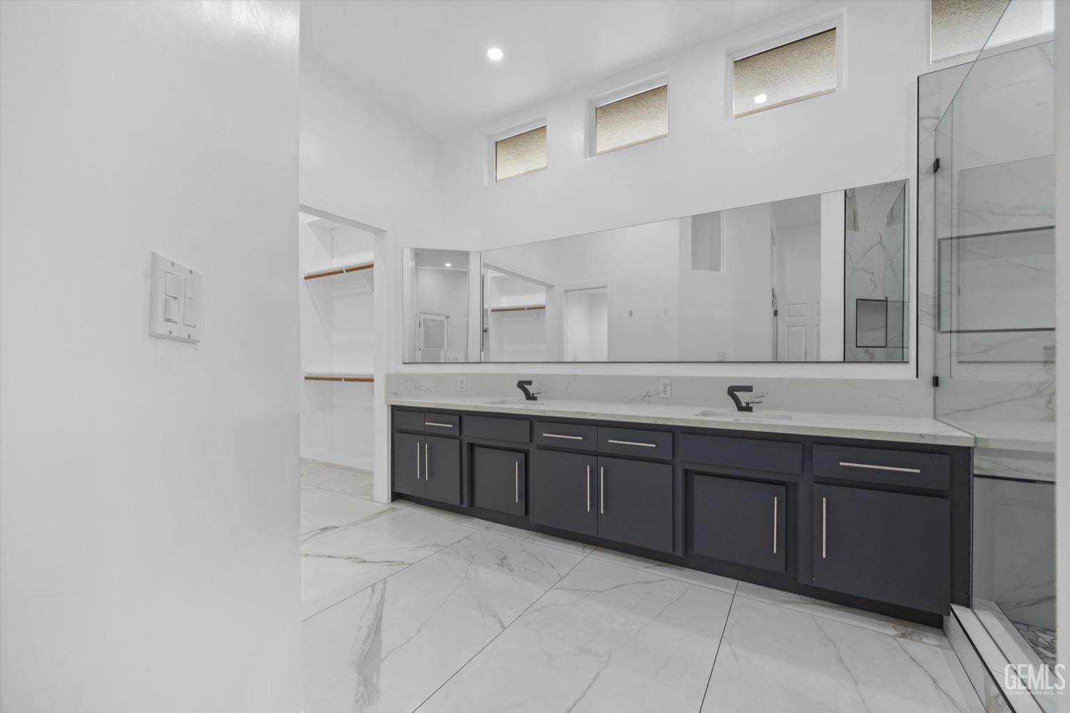 Undisclosed Address Bakersfield, CA 93311 - Photo 39 of 67 a large bathroom with a double vanity sink mirror and double