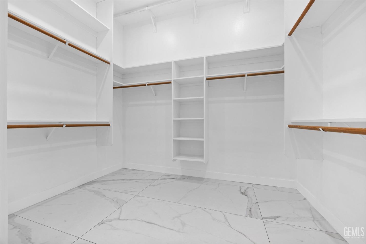 Undisclosed Address Bakersfield, CA 93311 - Photo 42 of 67 a view of an empty walk in closet