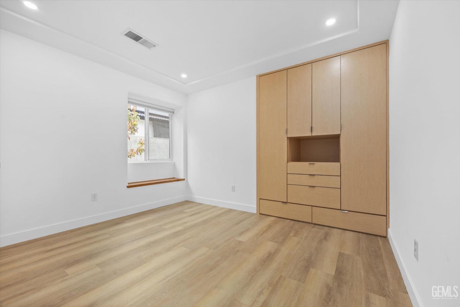 Undisclosed Address Bakersfield, CA 93311 - Photo 48 of 67 wooden floor in an empty room with a window