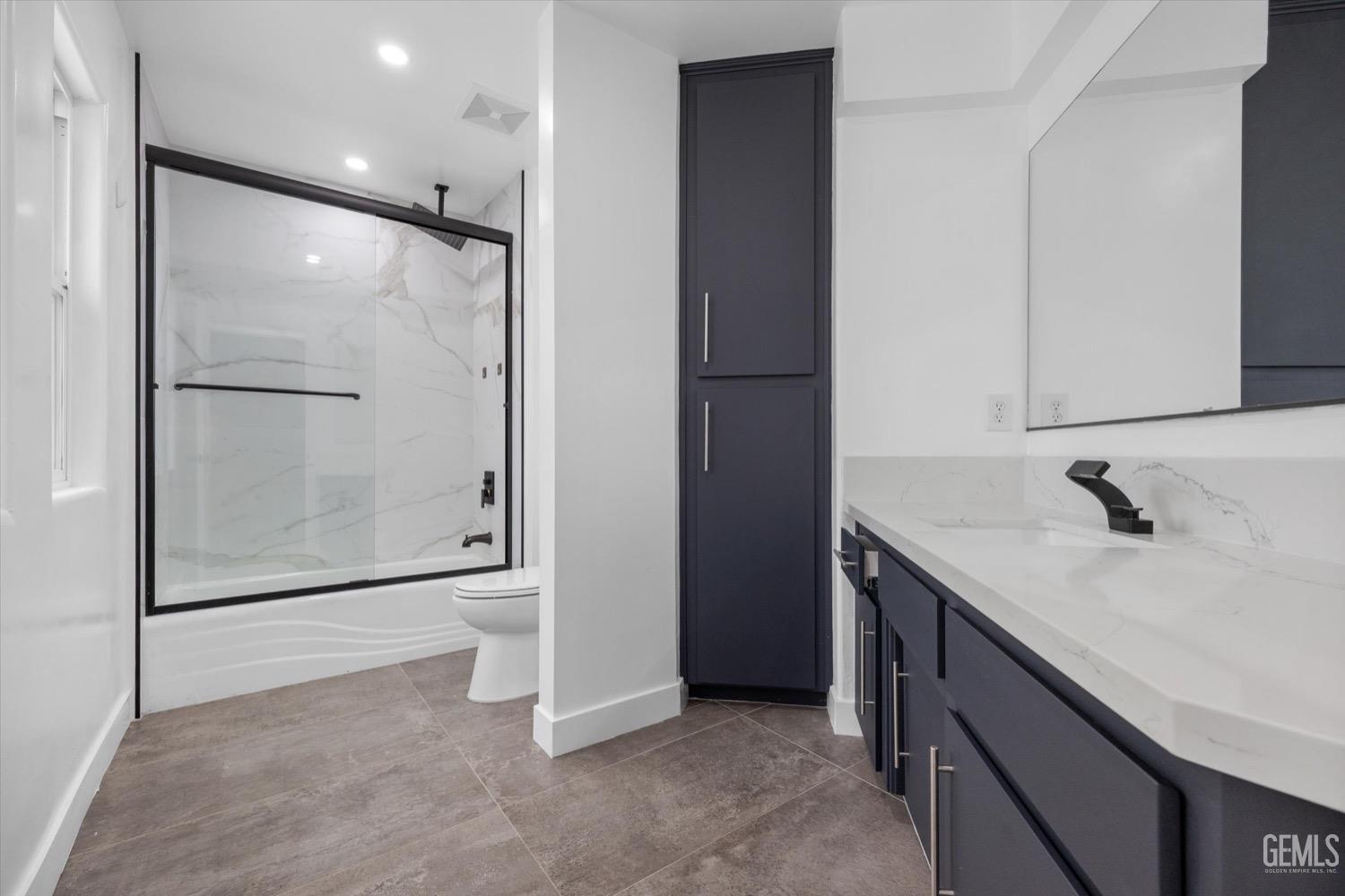 Undisclosed Address Bakersfield, CA 93311 - Photo 50 of 67 a bathroom with a granite countertop sink mirror and shower
