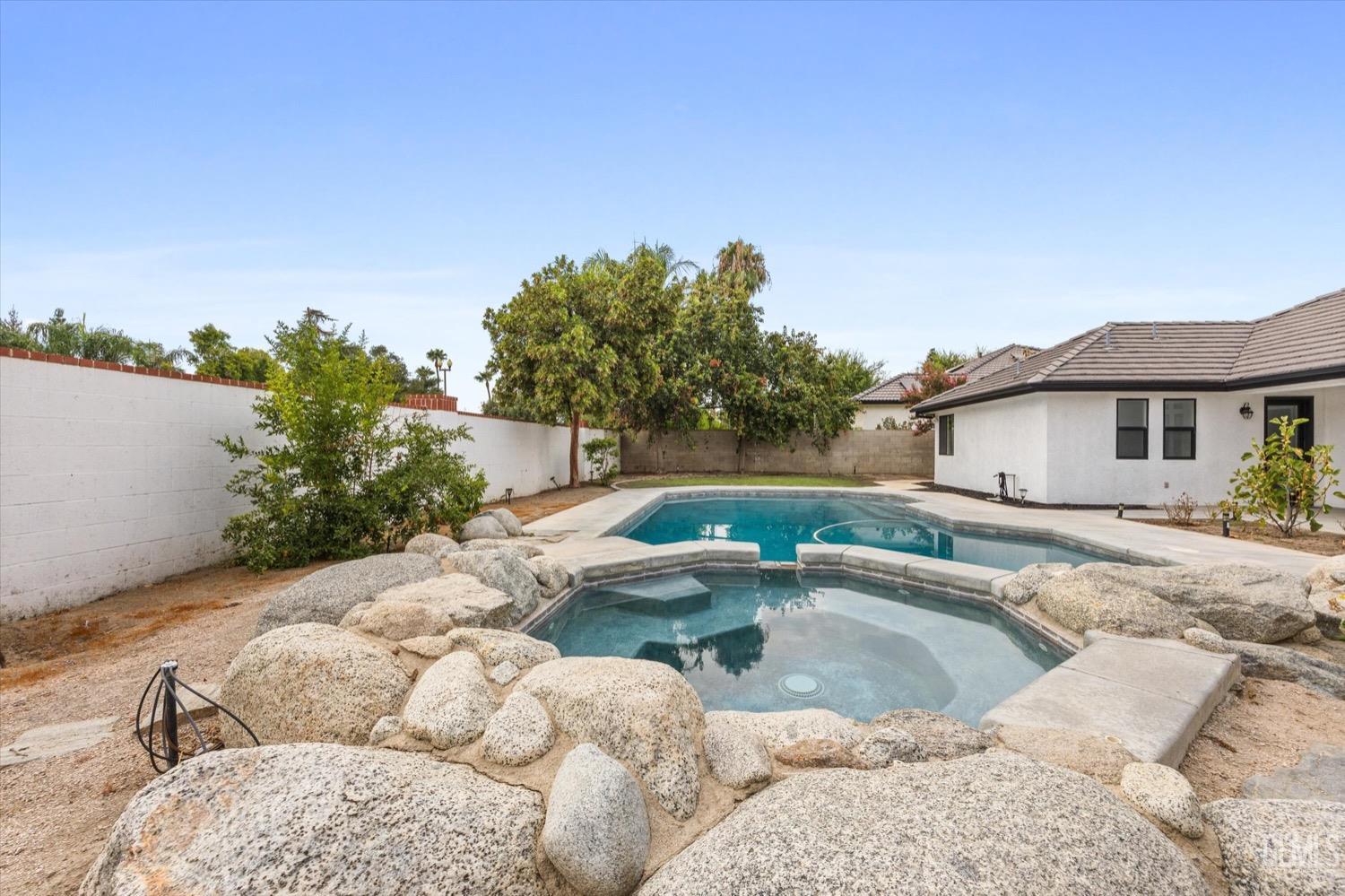 Undisclosed Address Bakersfield, CA 93311 - Photo 60 of 67 a view of backyard with swimming pool and outdoor seating