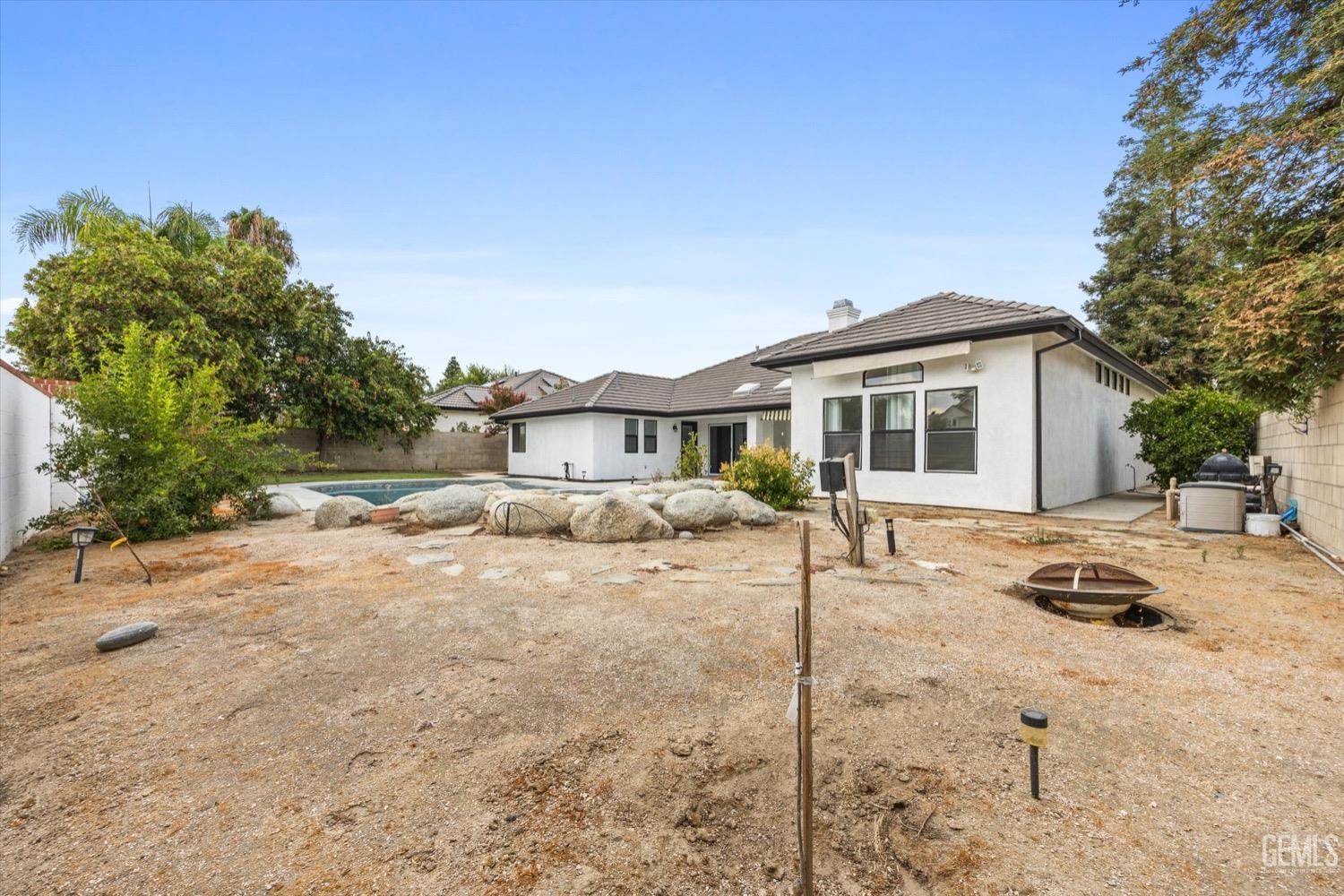 Undisclosed Address Bakersfield, CA 93311 - Photo 62 of 67 a view of a yard with a house and sitting area