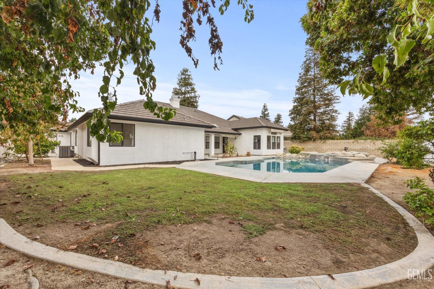 Undisclosed Address Bakersfield, CA 93311 - Photo 63 of 67 a view of a house with a backyard