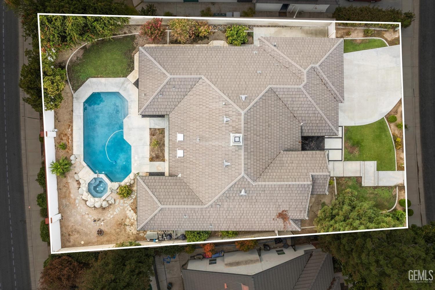 Undisclosed Address Bakersfield, CA 93311 - Photo 65 of 67 an aerial view of a house with a swimming pool