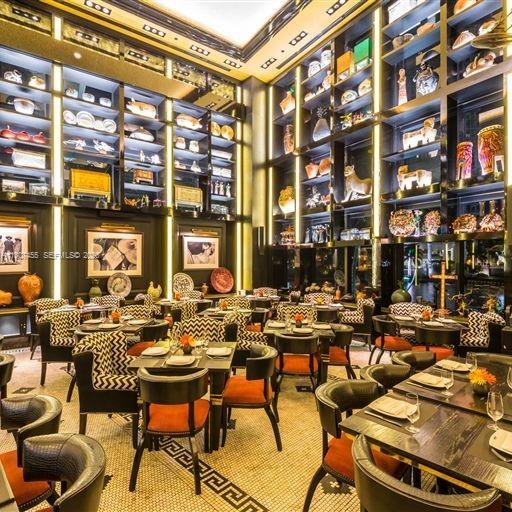 495 Brickell Avenue, Unit 2304 Miami, FL 33131 - Photo 28 of 29 a city view with a table and chairs