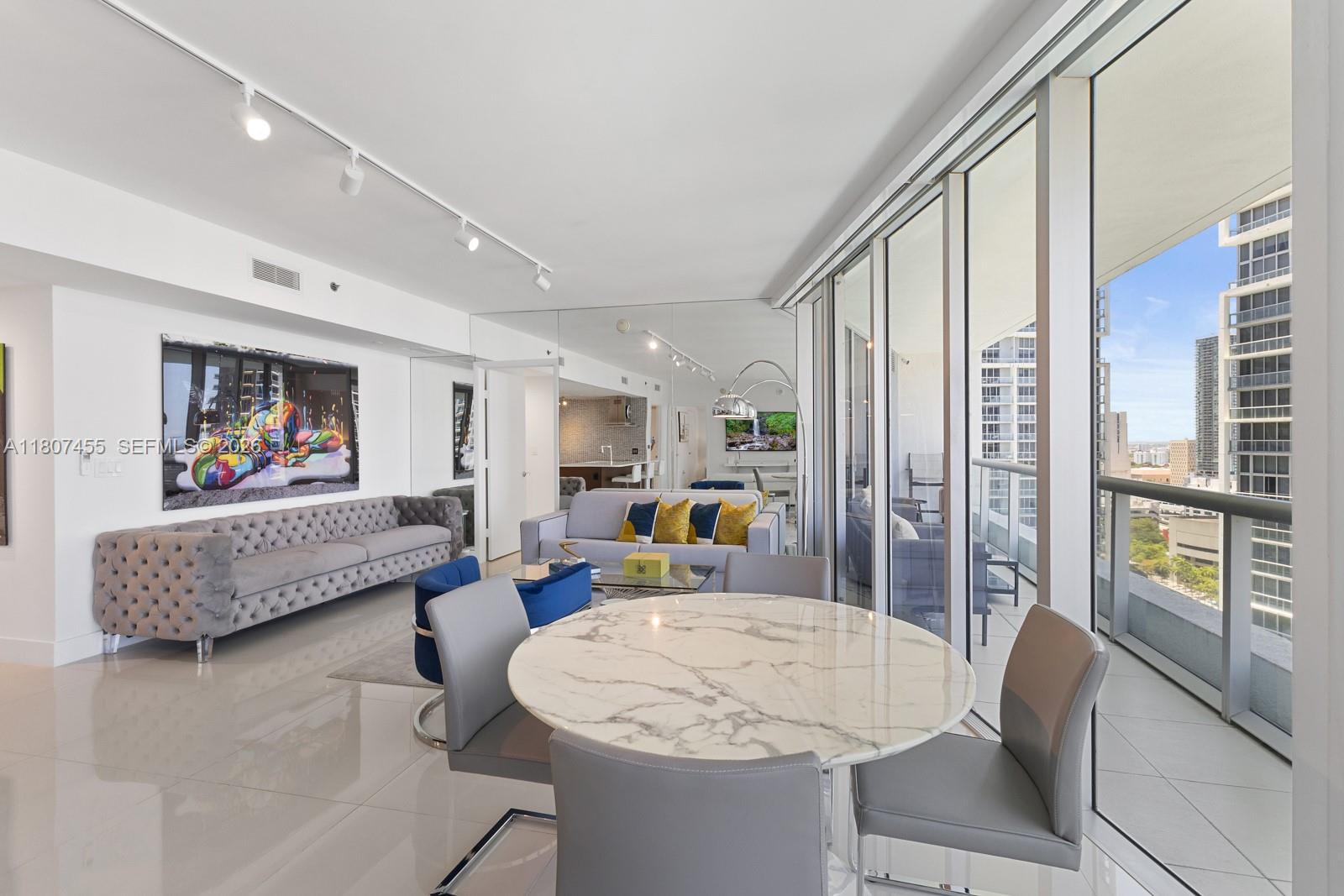 495 Brickell Avenue, Unit 2304 Miami, FL 33131 - Photo 5 of 29 a living room with furniture and a large window