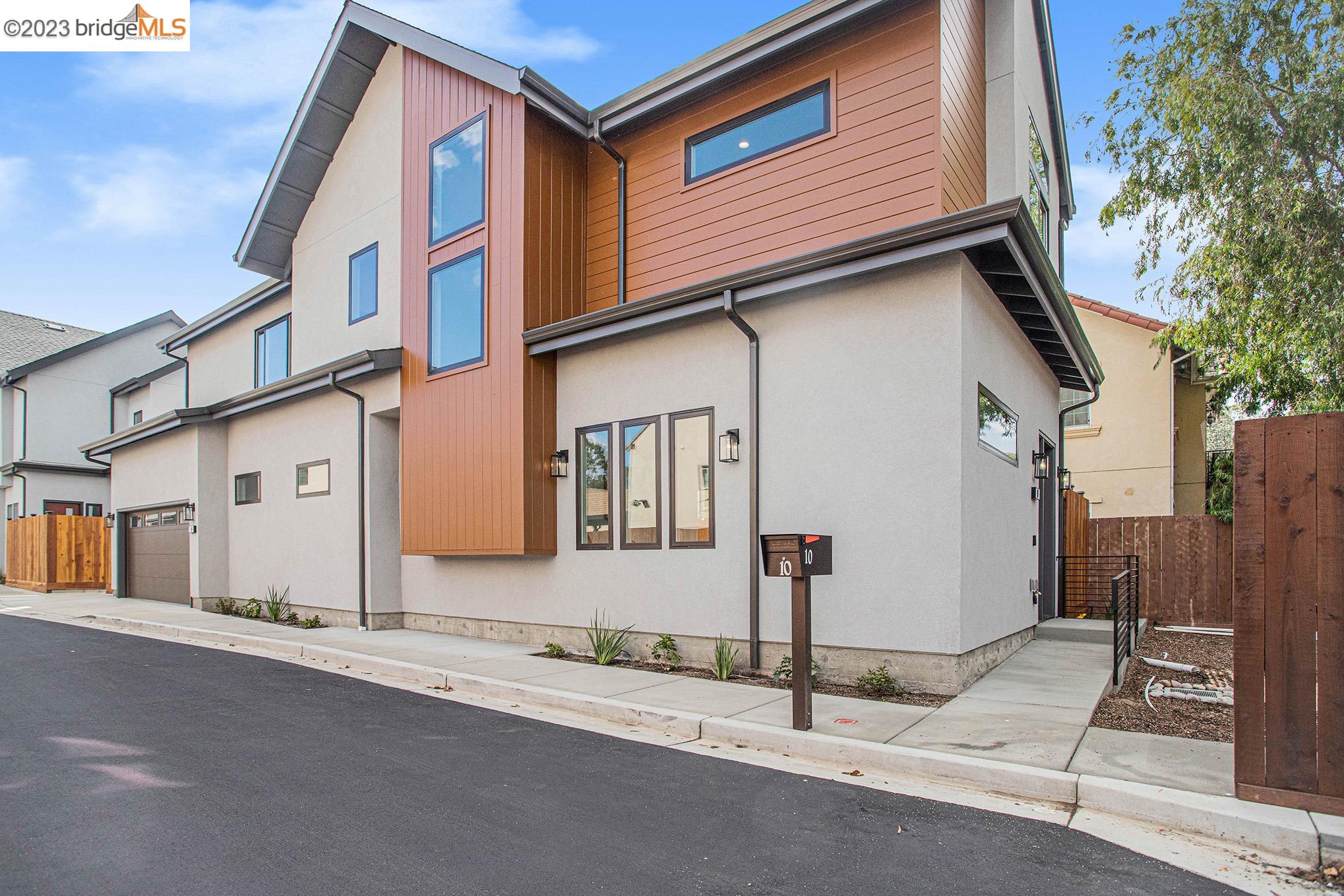 10 London Lane Rodeo, CA 94572 - Photo 1 of 1 a front view of a house with garage