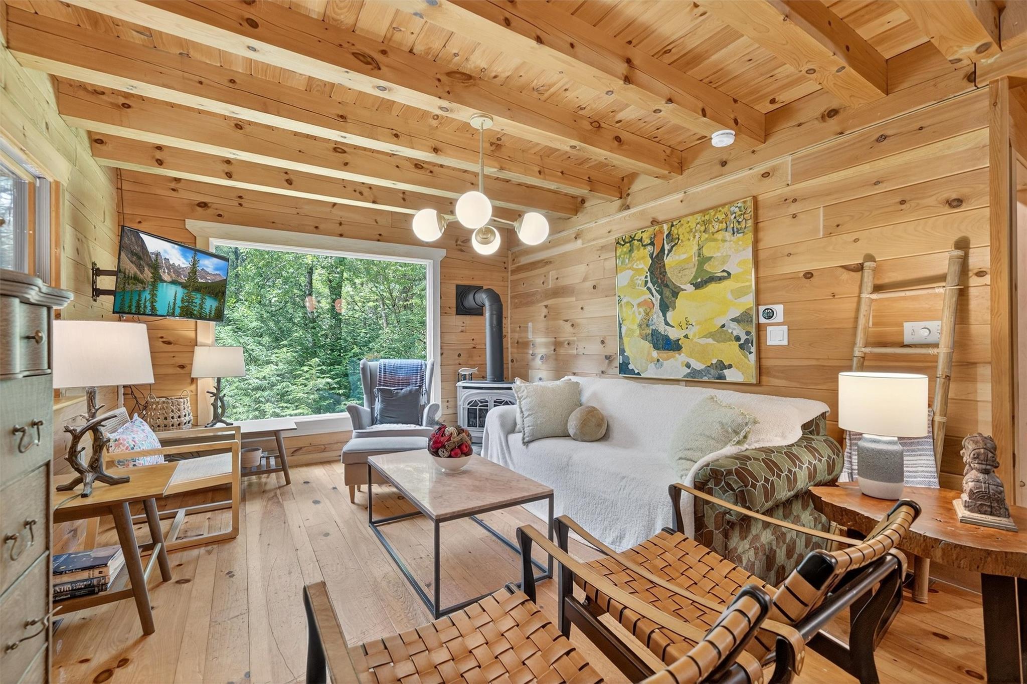 353 John Davis Road Beach Lake, PA 18405 - Photo 13 of 50 a living room with furniture and a large window